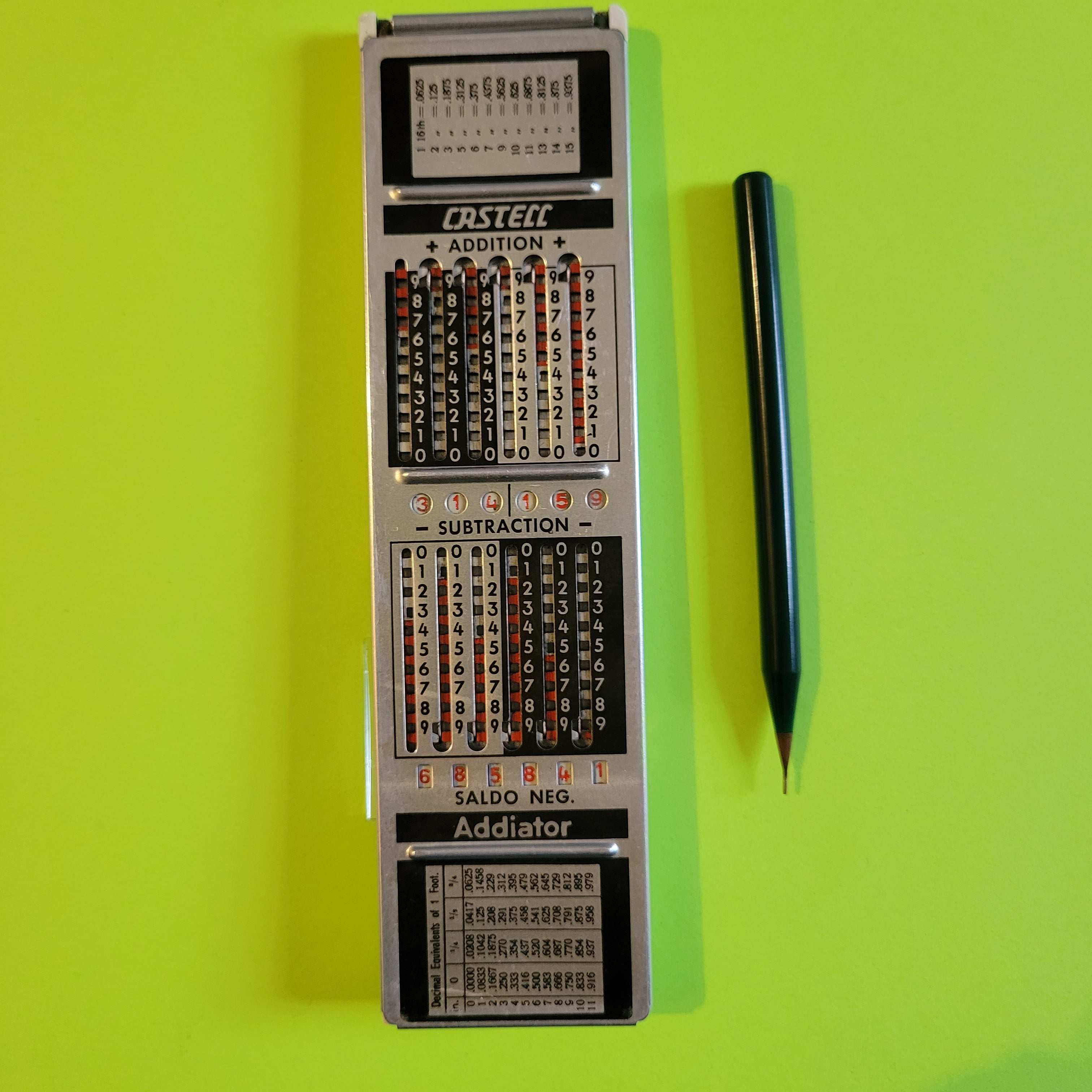 An image of the addiator mechanical calculator on the back of a Faber-Castelle 67/87Rb Rietz slide rule